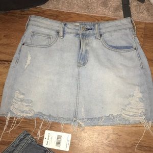 Distressed light wash denim skirt